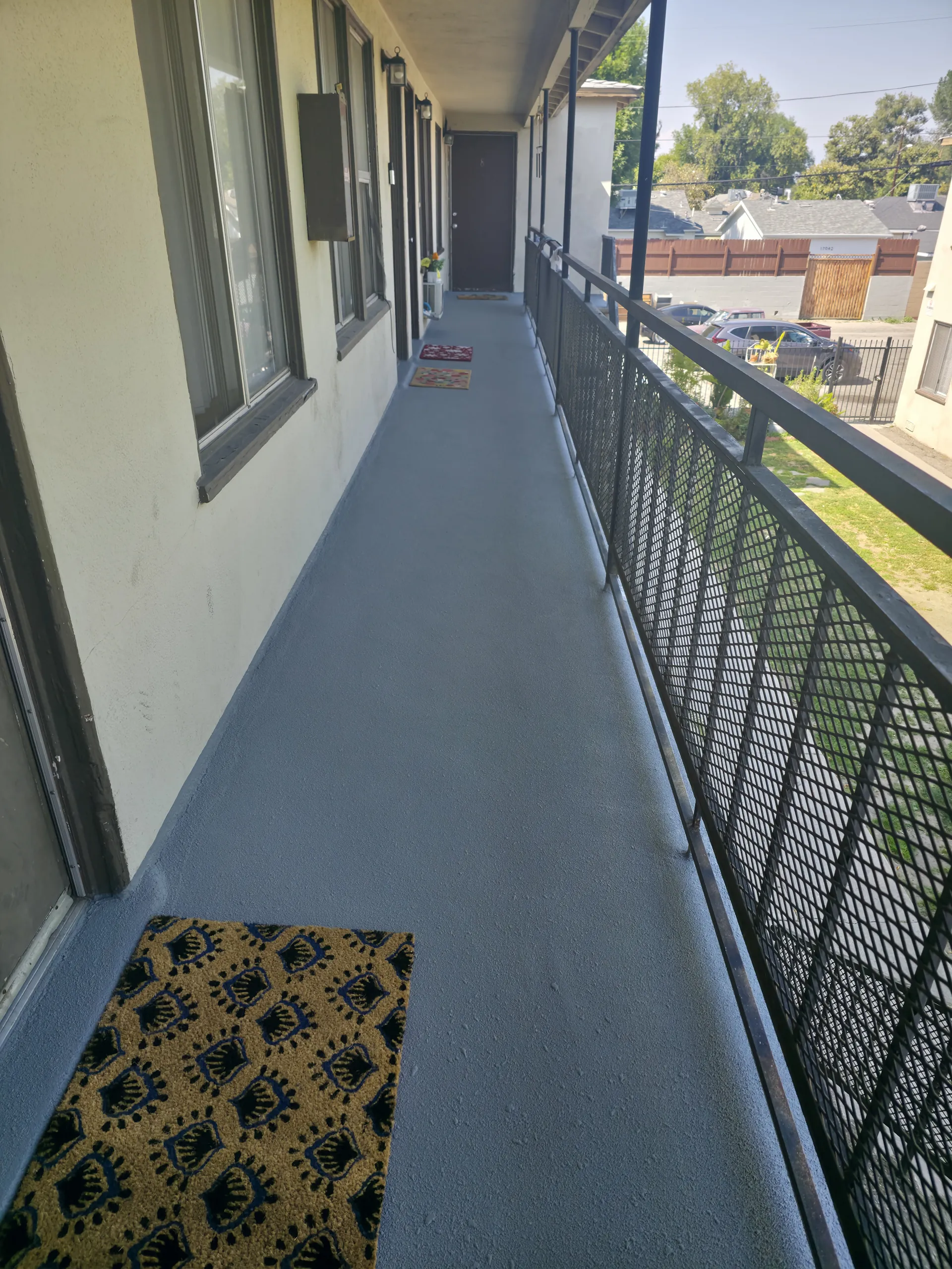 A multi-story apartment complex in Orange County with newly waterproofed walkways and balconies